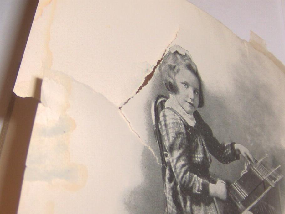 Large and somewhat dendritic tear across the top third of a page.